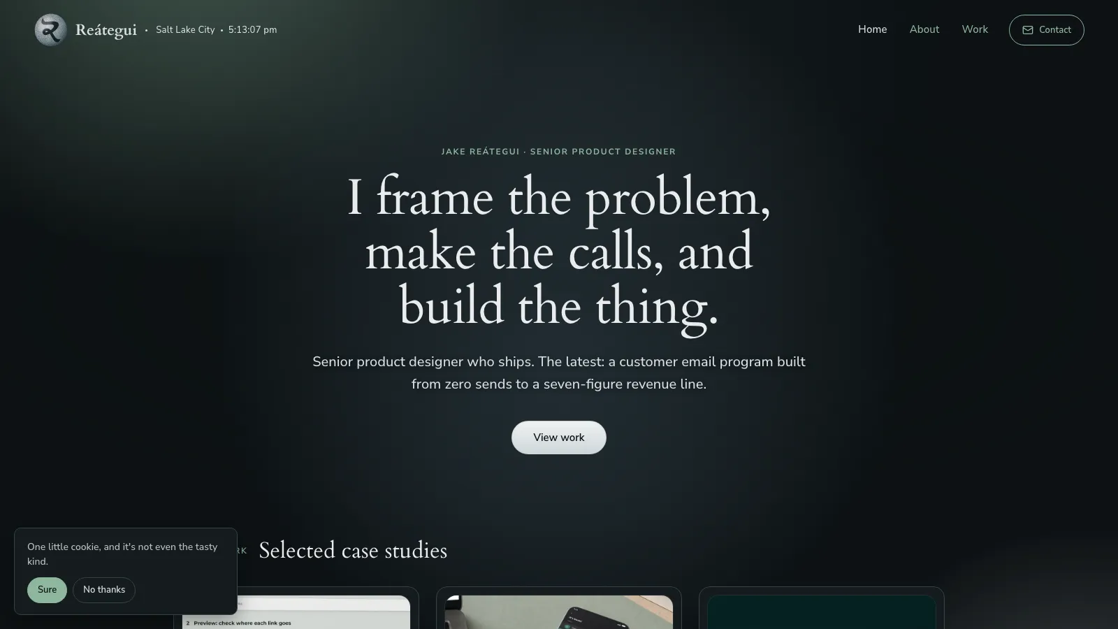 The jakereategui.com home page, deep steel surface with sage accents.