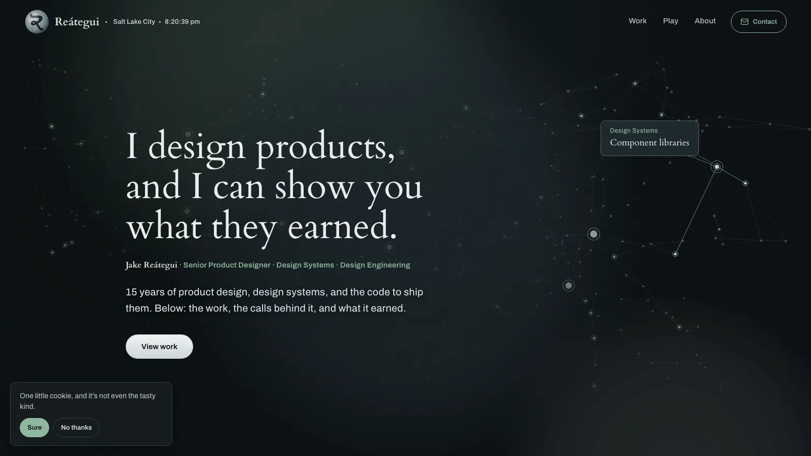The jakereategui.com home page, deep steel surface with sage accents.
